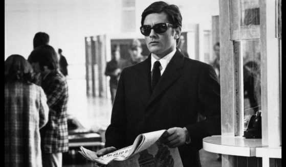 French actor Alain Delon stands in Fiumicino Airport, Rome, during the filming of 1969's 'The Sicilian Clan.'