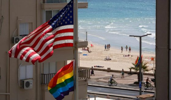 A U.S. flag is seen raised alongside a "pride" flag at the U.S. Embassy in Tel Aviv, Israel, in 2014.