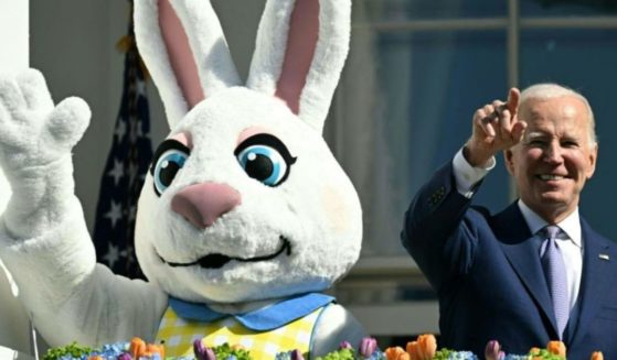 President Joe Biden, alongside the Easter Bunny, gestures after speaking at the annual Easter Egg Roll on the South Lawn of the White House in Washington, D.C., April 10, 2023.