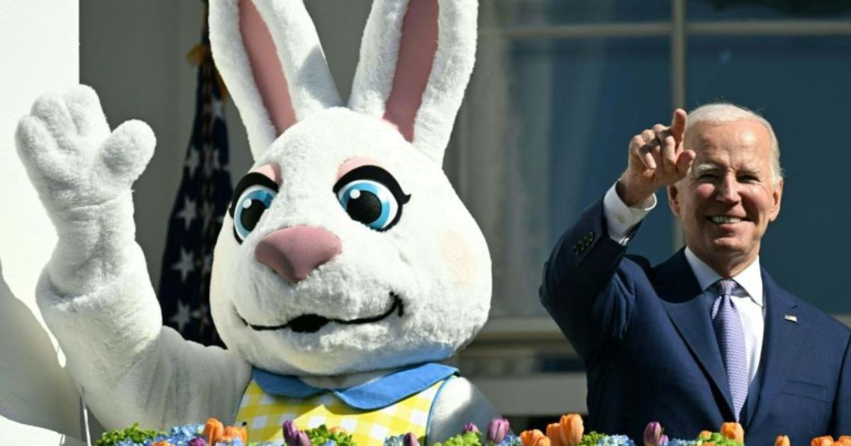 President Joe Biden, alongside the Easter Bunny, gestures after speaking at the annual Easter Egg Roll on the South Lawn of the White House in Washington, D.C., April 10, 2023.