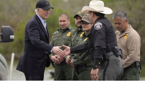 President Joe Biden talks with U.S. Border Patrol and local officials Thursday as he looks over the southern border in Brownsville, Texas, along the Rio Grande.