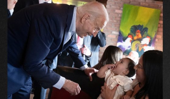 President Joe Biden wandered off the stage area to visit with a mother and baby while his campaign manager was introducing him during a campaign event at a Mexican restaurant in Phoenix, Arizona, on Tuesday.