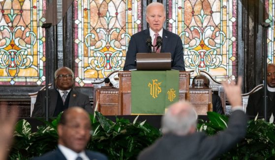 President Joe Biden watches as protesters are escorted out of the Emanuel AME Church on Jan. 8 in Charleston, South Carolina.
