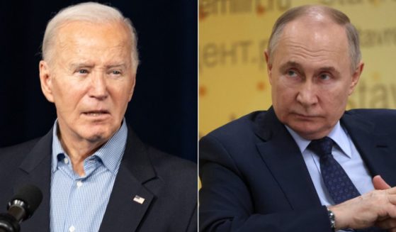During a Wednesday interview, Russian President Vladimir Putin, right, said the Russia is "ready" for nuclear war and warned President Joe Biden, left, to keep U.S. soldiers out of Ukraine.