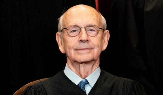 Then-Associate Justice Stephen Breyer sits during a group photo of the justices at the Supreme Court in Washington on April 23, 2021.