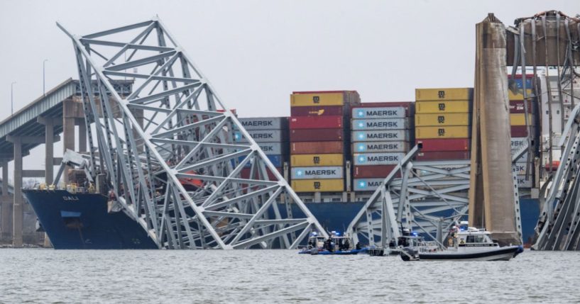 The collapsed Francis Scott Key Bridge lies on top of the container ship Dali in Baltimore on Wednesday.