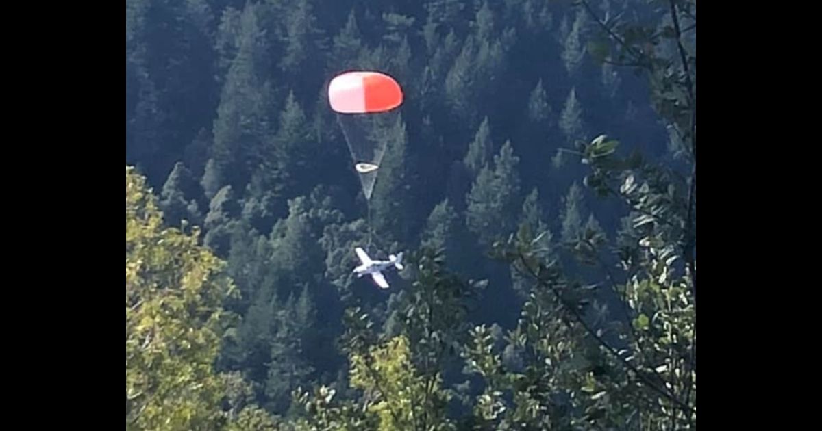 A Cirrus aircraft uses its CAPS parachute near Whitethorn, California.