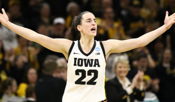 Iowa Hawkeyes' Caitlin Clark celebrates after drawing a foul late in the second half against the West Virginia Mountaineers during their second round match-up in the 2024 NCAA Division 1 Women's Basketball Championship in Iowa City, Iowa, on Monday.