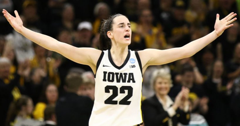 Iowa Hawkeyes' Caitlin Clark celebrates after drawing a foul late in the second half against the West Virginia Mountaineers during their second round match-up in the 2024 NCAA Division 1 Women's Basketball Championship in Iowa City, Iowa, on Monday.