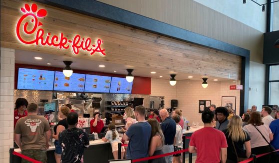 People line up to order fast food from a Chick-fil-A restaurant at the Iroquois Travel Plaza rest stop in Little Falls, New York.