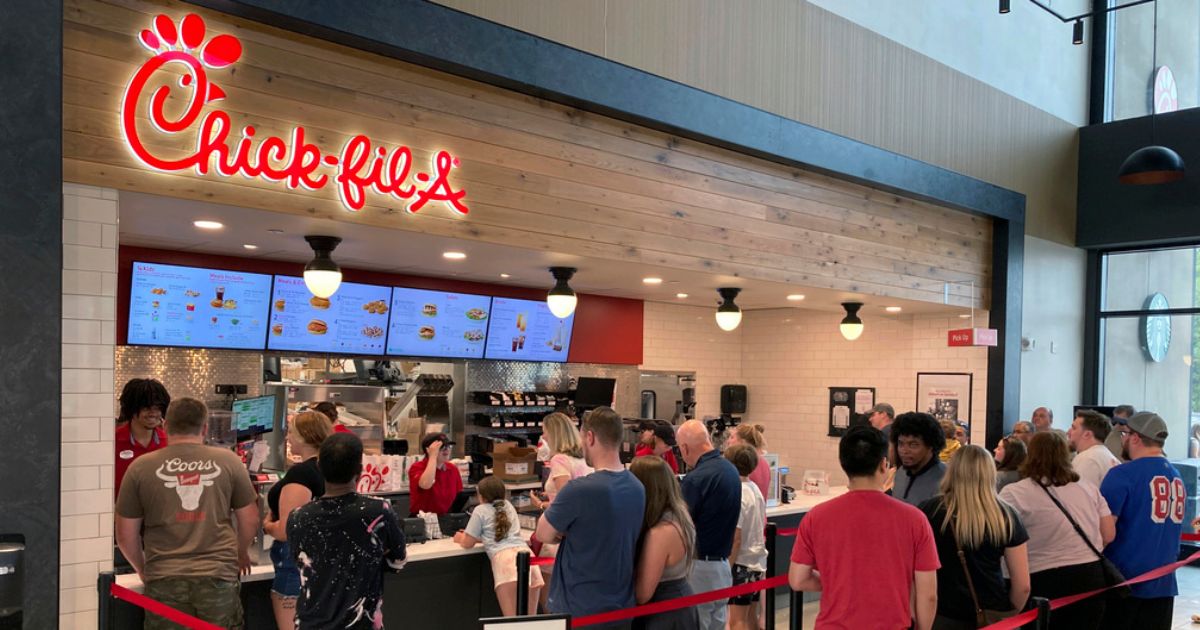 People line up to order fast food from a Chick-fil-A restaurant at the Iroquois Travel Plaza rest stop in Little Falls, New York.