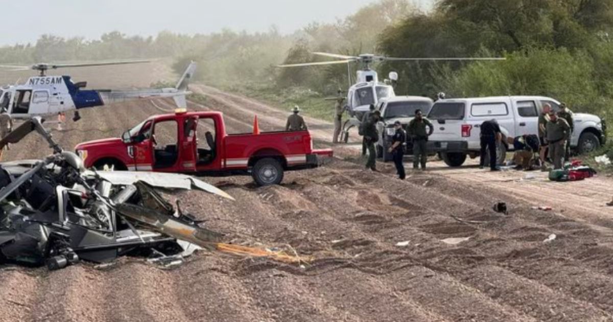 Officials respond to the site of Friday's National Guard helicopter crash near La Grulla, Texas.