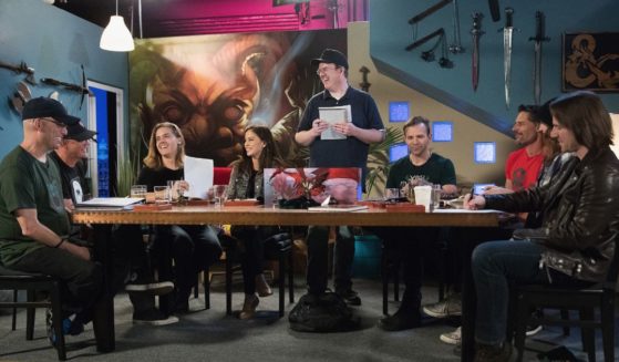 Celebrities circle around a table to play Dungeons & Dragons together at The House Studios in 2017.