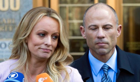 Stormy Daniels, left, stands with her lawyer Michael Avenatti outside federal court in New York, on April 16, 2018.