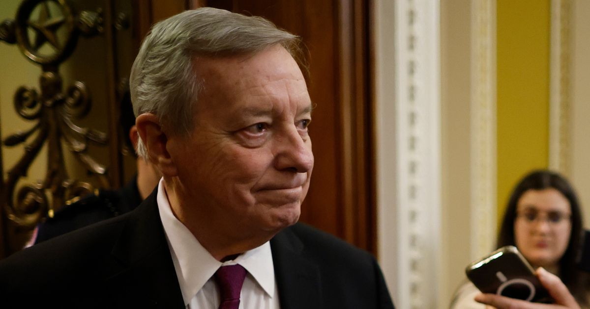 Senate Majority Whip Richard Durbin talks briefly with reporters as he heads into the Senate Chamber at the U.S. Capitol in Washington on Feb. 12.