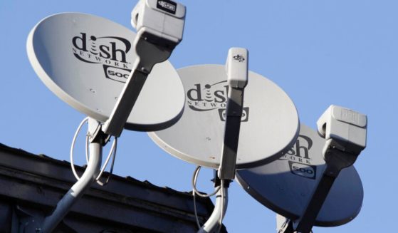 Dish Network satellite dishes are shown at an apartment complex in Palo Alto, California.