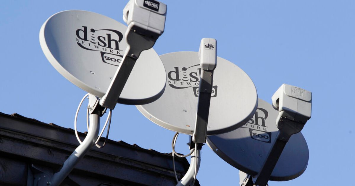 Dish Network satellite dishes are shown at an apartment complex in Palo Alto, California.
