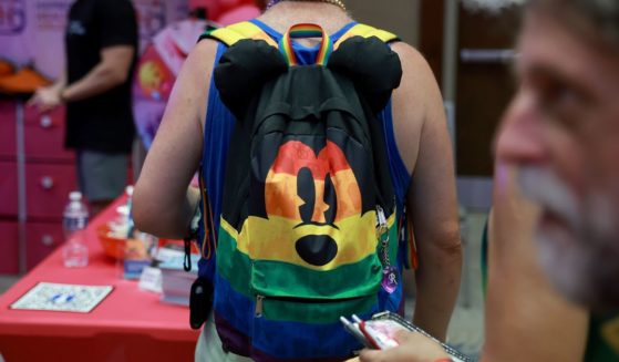 A Mickey Mouse backpack adorned with gay pride colors at the Gay Days festivities at SeaWorld in 2023.