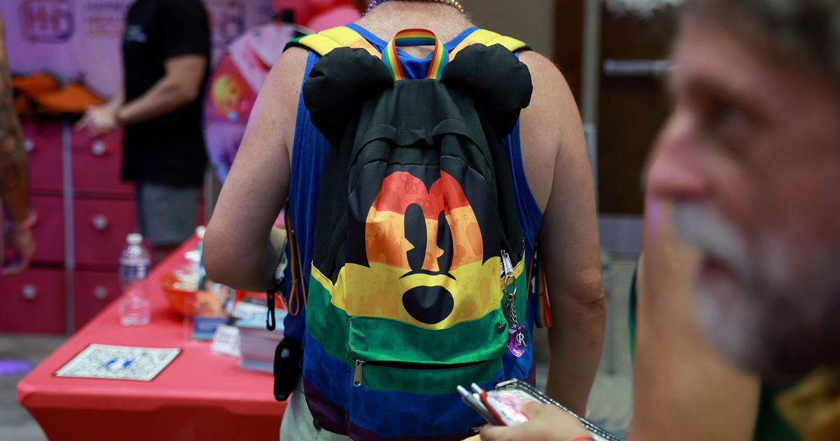 A Mickey Mouse backpack adorned with gay pride colors at the Gay Days festivities at SeaWorld in 2023.