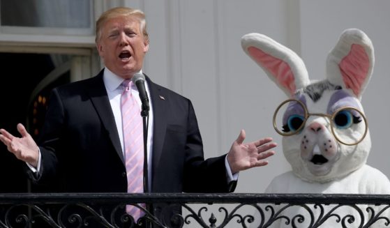 President Donald J. Trump standing next to an individual in an Easter Bunny suit in 2019.