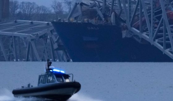 The cargo ship Dali is covered in the wreckage of the collapsed Francis Scott Key Bridge in Baltimore, Maryland, on Tuesday.