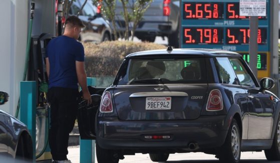 A customer pumps gas at a gas station in Petaluma, California, on Sept. 13.