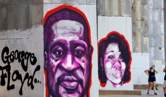 Portraits of George Floyd, left, and Breonna Taylor, right, are painted in Pittsburgh, Pennsylvania, as part of a Black Lives Matter Mural.