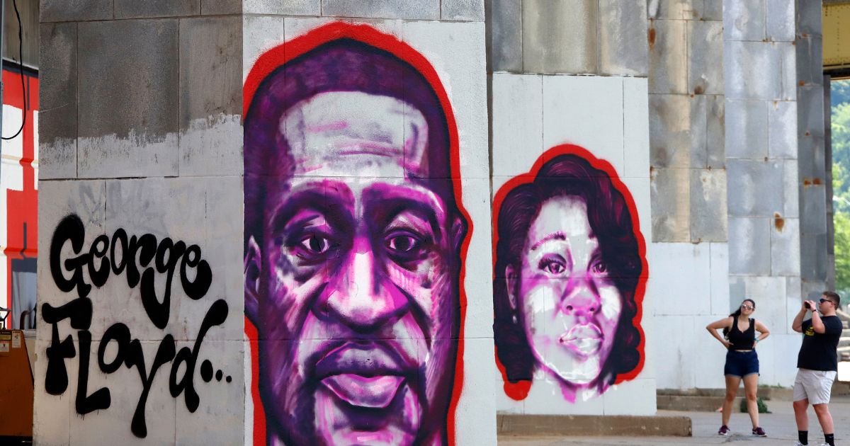 Portraits of George Floyd, left, and Breonna Taylor, right, are painted in Pittsburgh, Pennsylvania, as part of a Black Lives Matter Mural.