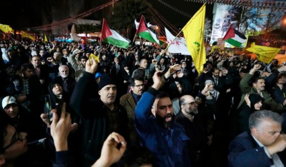 Iranian protesters chant slogans as some of them wave Palestinian flags during an anti-Israeli demonstration Sunday in downtown Tehran, Iran.