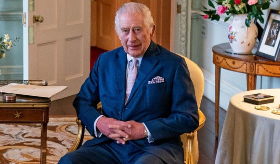 King Charles poses for a photograph while meeting with Britain's Chancellor of the Exchequer Jeremy Hunt in Buckingham Palace in London, England, on March 5.