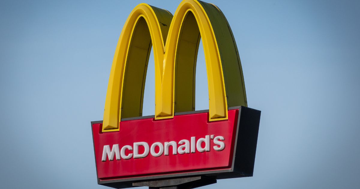 The Golden Arches and Drive Thru logo of the fast food restaurant McDonald's is pictured in Bristol, England, on Feb. 25.