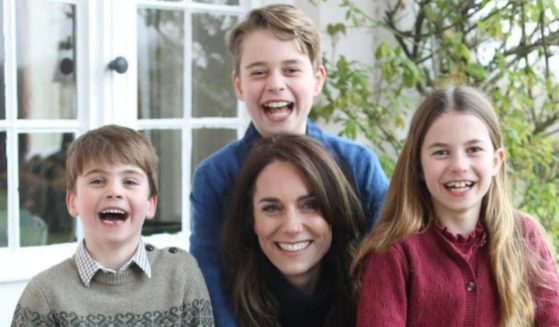An image of Princess of Wales Kate Middleton with her children, Louis, left, George, top, and Charlotte.
