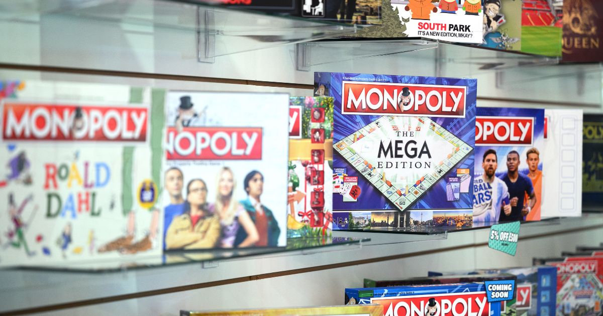 A series of boxed Monopoly board games lined up next to one another at the 2022 Toy Fair in London, England.