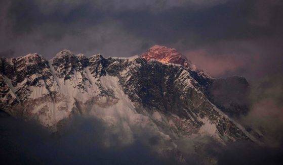 the last light of the day setting on Mount Everest
