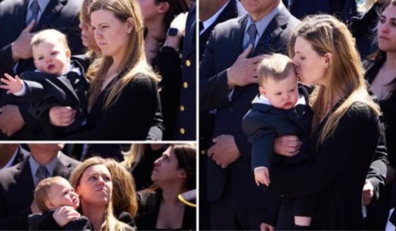 The wife of slain police officer Jonathan Diller, Stephanie, and their son, Ryan, at Jonathan's funeral Saturday.
