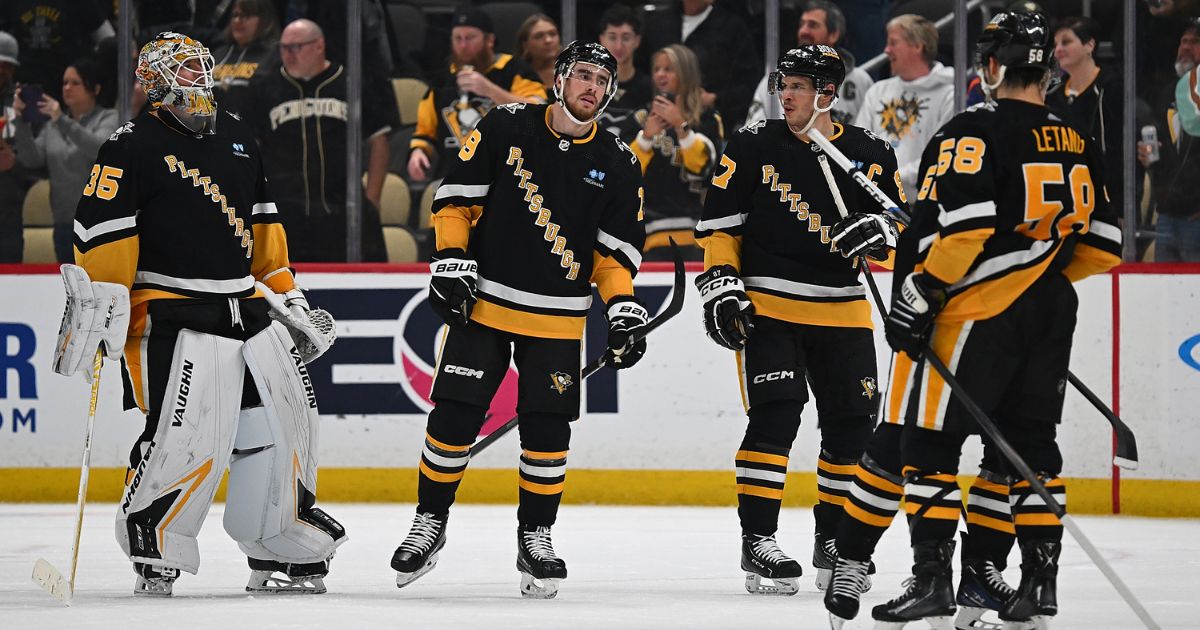 The Pittsburgh Penguins celebrate following a 6-3 win over the San Jose Sharks at PPG PAINTS Arena on Thursday.