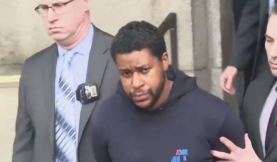 New Yorkers shouted at Lindy Jones, who is accused of fatally shooting New York Police Department Officer Jonathan Diller, as he was escorted by NYPD detectives.