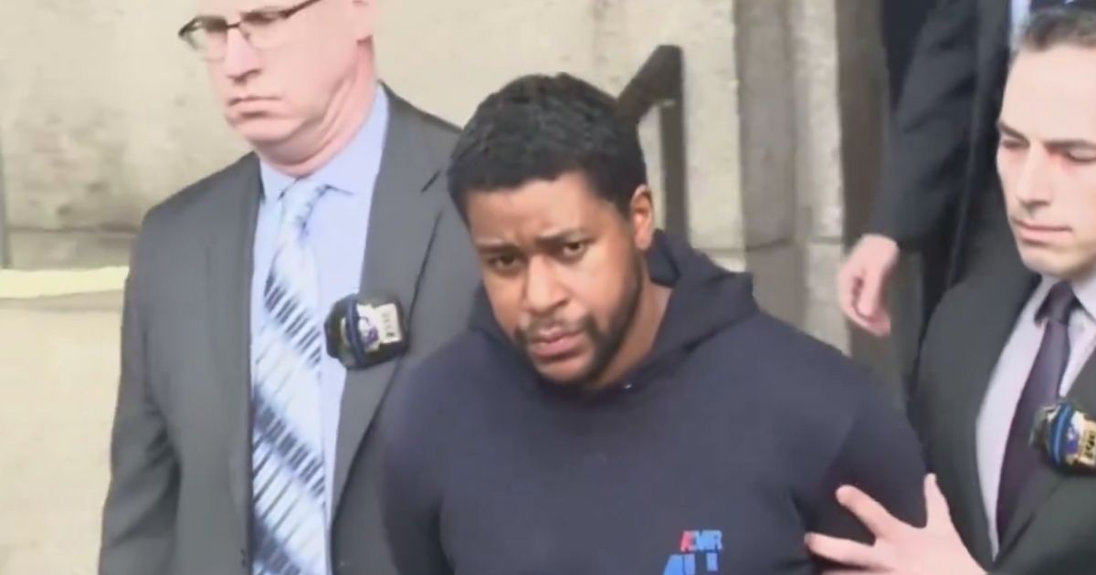 New Yorkers shouted at Lindy Jones, who is accused of fatally shooting New York Police Department Officer Jonathan Diller, as he was escorted by NYPD detectives.