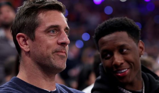 New York Jets players Aaron Rodgers, left, and Sauce Gardner, right, attend game two of the Eastern Conference Semifinals between the New York Knicks and the Miami Heat in New York City on May 2, 2023.
