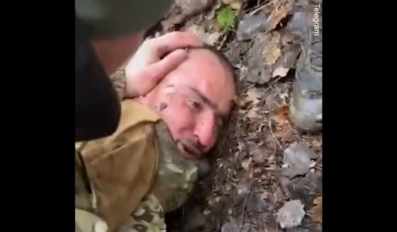 Russian prisoner Saidakrami Rachabalizoda, a suspect in the March 22 terrorist attack, is beaten by soldiers.