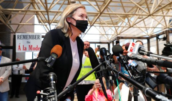 Salon owner Shelley Luther leans in to speak to the media and supporters after she was released from jail in Dallas, May 7, 2020.