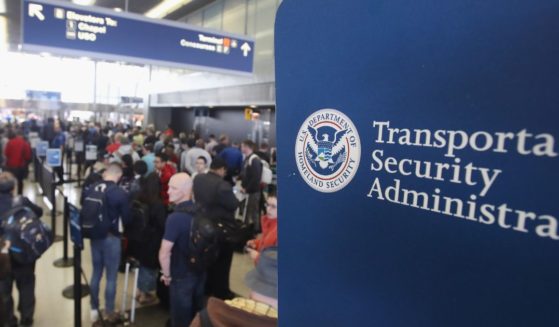 Passengers at O'Hare International Airport in Chicago wait in line to be screened at a Transportation Security Administration checkpoint on May 16, 2016.