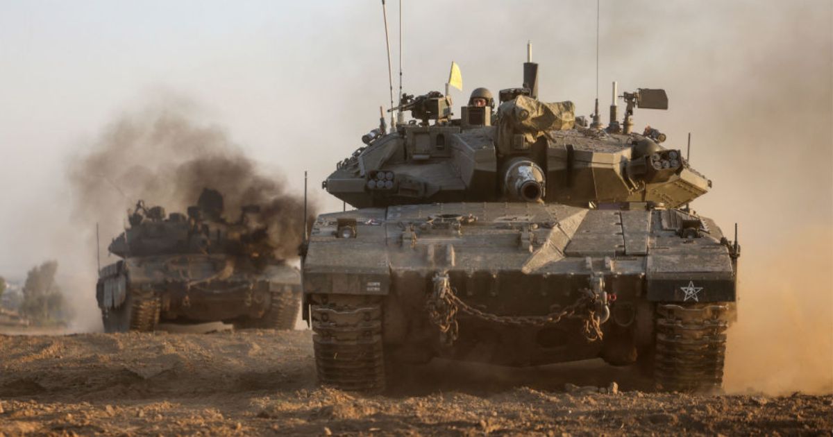 Israeli military tanks roll near the border with the Gaza Strip on Dec. 3, amid continuing battles between Israel and the militant group Hamas.