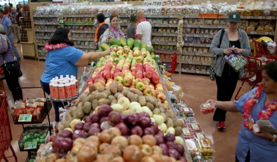 Shoppers peruse the produce section at Trader Joe's in a Pinecrest, Florida in a file photo from October 2013.