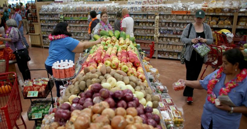 Shoppers peruse the produce section at Trader Joe's in a Pinecrest, Florida in a file photo from October 2013.