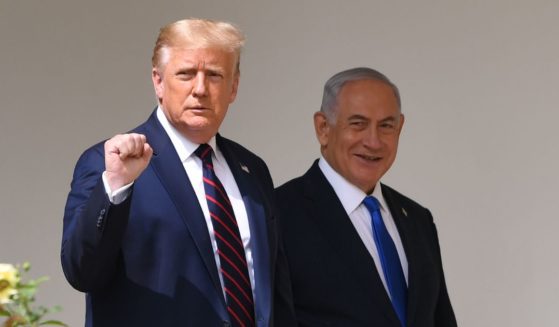 Then-President Donald Trump, left, and Israeli Prime Minister Benjamin Netanyahu, right, arrive to participate in the signing of the Abraham Accords at the White House in Washington, D.C., on Sept. 15, 2020.