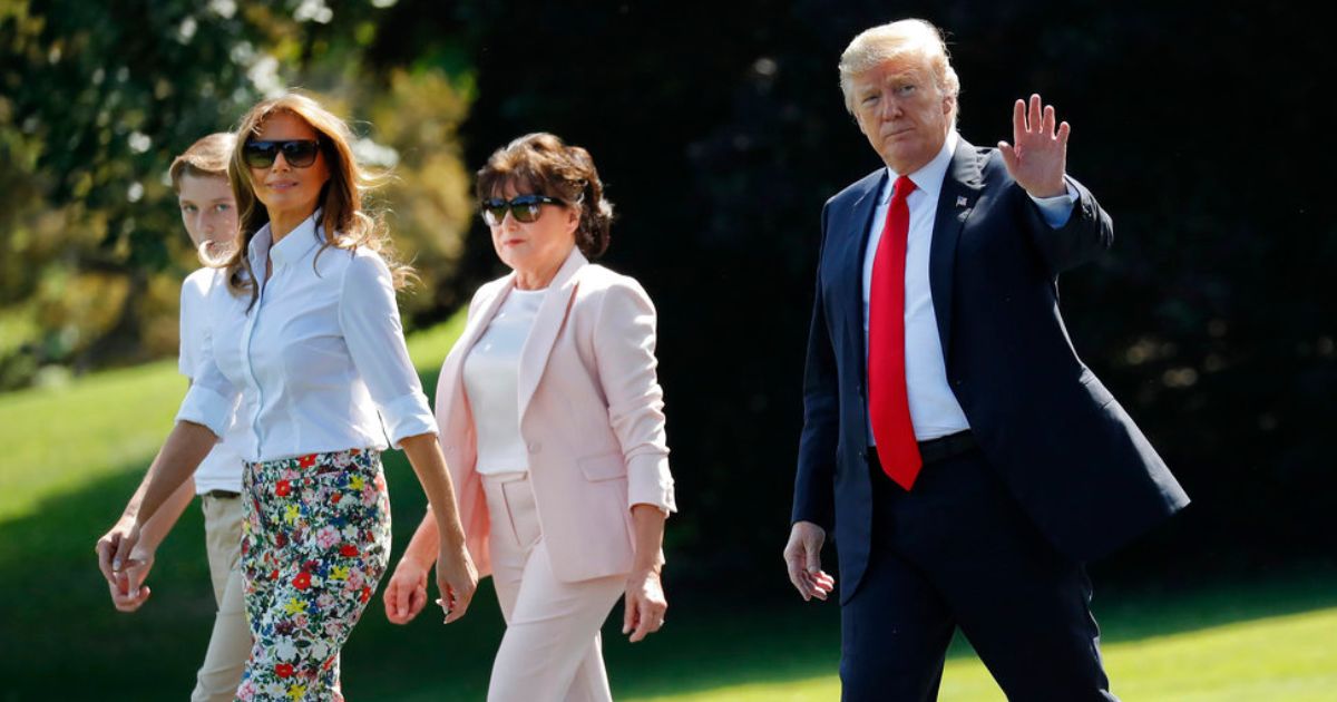 President Donald Trump, right, waves as he walks out, with from l-r., son Barron, first lady Melania Trump, and Amalija Knavs, mother of first lady Melania Trump, as they walk across the South Lawn of the White House in Washington, June 29, 2018.