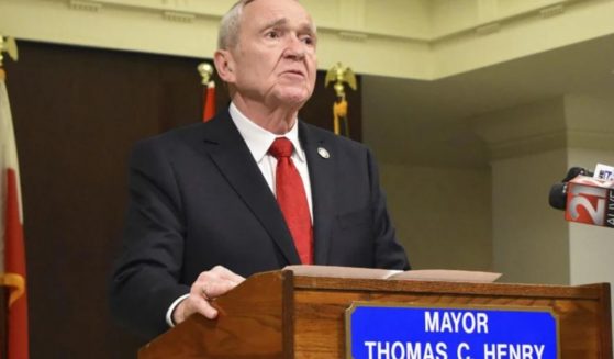 Fort Wayne Mayor Tom Henry speaks with reporters and his staff in the Indiana city on Feb. 26. Henry announced during the day that he had been diagnosed with late-stage stomach cancer. Henry died on Thursday.