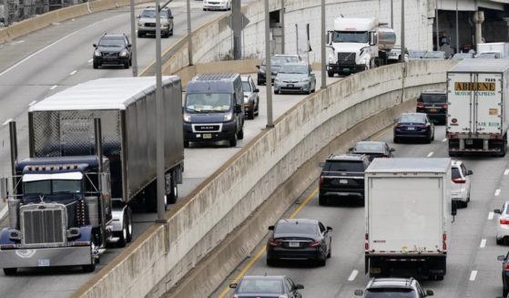 Motor vehicle traffic moves along Interstate 76 in Philadelphia in 2021. The EPA on Friday set new gas emissions standards for heavy-duty trucks, buses and other large vehicles.