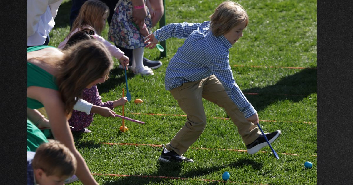 Children participate in the 2023 White House Easter Egg Roll on the South Lawn of the White House.